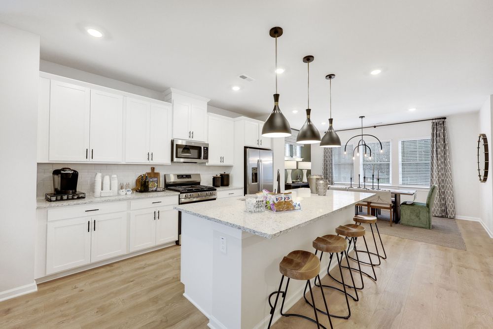 hj-nc-raleigh-buffalo-townes-cobblestone-lot-28-kitchen-to-dining-area-01.jpg